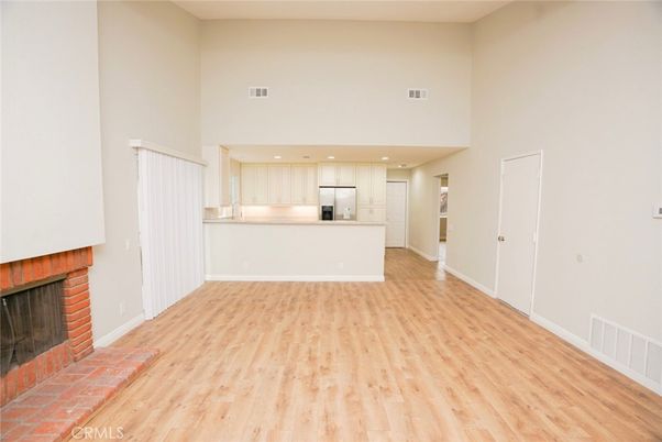 Empty room, Fireplace, Interior, Kitchen, Pendant Lights, Recessed Lighting, Wood Texture Flooring