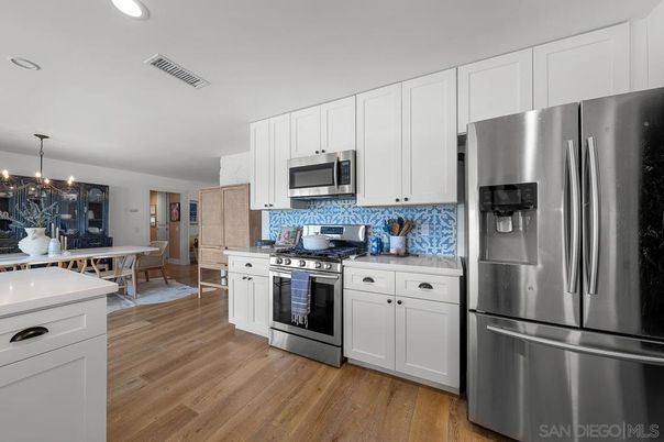Dining room, Interior, Kitchen, Pendant Lights, Recessed Lighting, Stainless Steel Appliances, Wood Texture Flooring