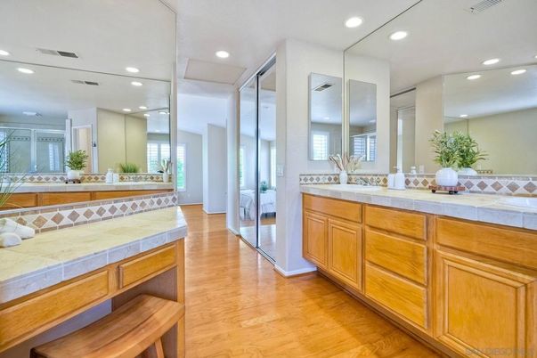 Bathroom, Dual Sink Vanities, Interior, Recessed Lighting, Tile Countertops, Wood Texture Flooring