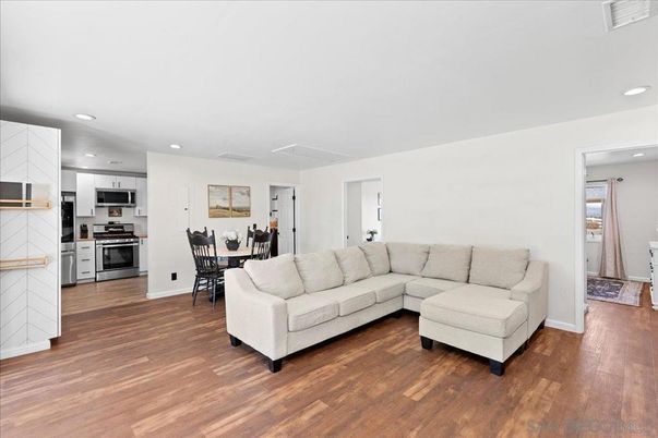 Dining room, Interior, Kitchen, Living room, Recessed Lighting, Stainless Steel Appliances, Wood Texture Flooring