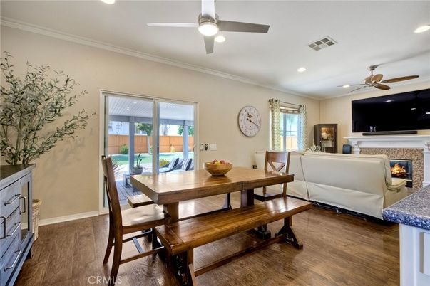 Dining room, Fireplace, Interior, Living room, Recessed Lighting, Wood Texture Flooring