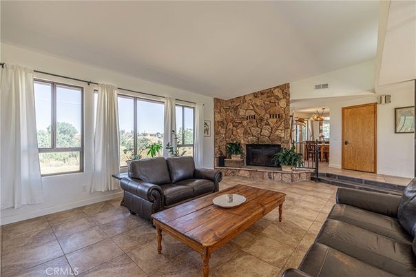 Chandelier, Fireplace, Interior, Living room, Stone Walls