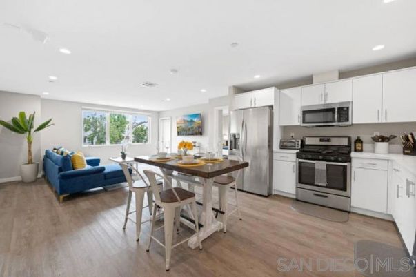 Dining room, Interior, Kitchen, Living room, Recessed Lighting, Stainless Steel Appliances, Wood Texture Flooring