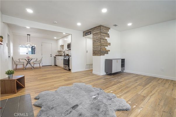 Dining room, Interior, Kitchen, Pendant Lights, Recessed Lighting, Stainless Steel Appliances, Wood Texture Flooring