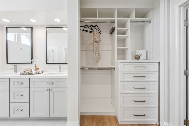 Bathroom, Dual Sink Vanities, Interior, Recessed Lighting, Walk-in Closets, Wood Texture Flooring