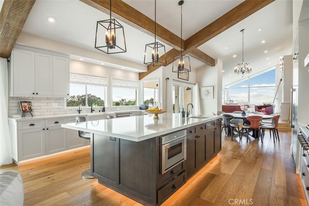 Chandelier, Dining room, Interior, Kitchen, Pendant Lights, Recessed Lighting, Stainless Steel Appliances, Wooden Beams, Wood Texture Flooring