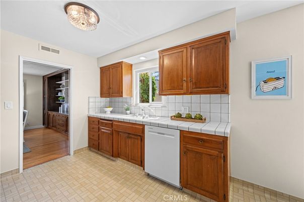 Interior, Kitchen, Recessed Lighting, Tile Countertops, Wood Texture Flooring
