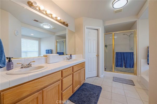 Bathroom, Dual Sink Vanities, Glass Shower, Interior, Recessed Lighting, Tile Countertops