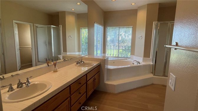 Bathroom, Dual Sink Vanities, Interior, Recessed Lighting, Tile Countertops, Wood Texture Flooring
