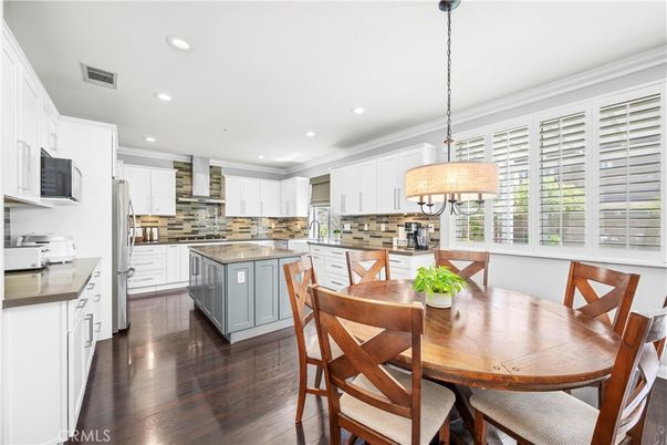 Chandelier, Dining room, Interior, Kitchen, Pendant Lights, Recessed Lighting, Stainless Steel Appliances, Wood Texture Flooring