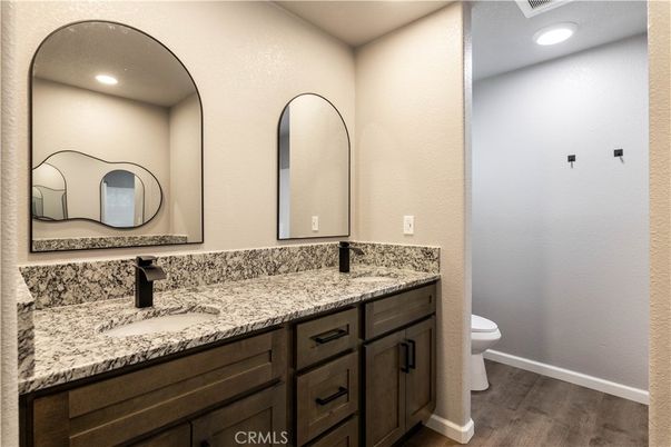 Bathroom, Dual Sink Vanities, Interior, Recessed Lighting, Wood Texture Flooring