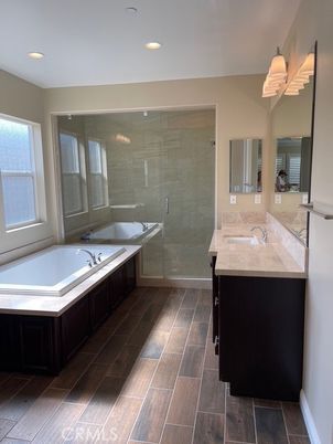 Bathroom, Dual Sink Vanities, Glass Shower, Interior, Recessed Lighting, Wood Texture Flooring