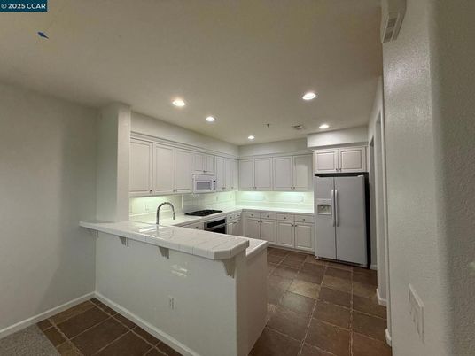 Interior, Kitchen, Recessed Lighting, Tile Countertops