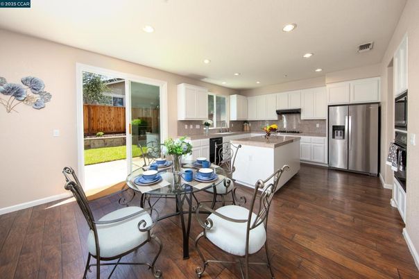 Dining room, Interior, Kitchen, Recessed Lighting, Stainless Steel Appliances, Wood Texture Flooring