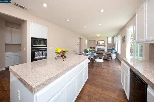 Dining room, Fireplace, Interior, Kitchen, Recessed Lighting, Wood Texture Flooring