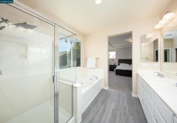 Bathroom, Bedroom, Dual Sink Vanities, Glass Shower, Interior, Recessed Lighting, Wood Texture Flooring