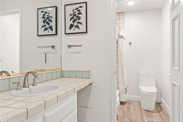 Bathroom, Interior, Recessed Lighting, Tile Countertops, Wood Texture Flooring