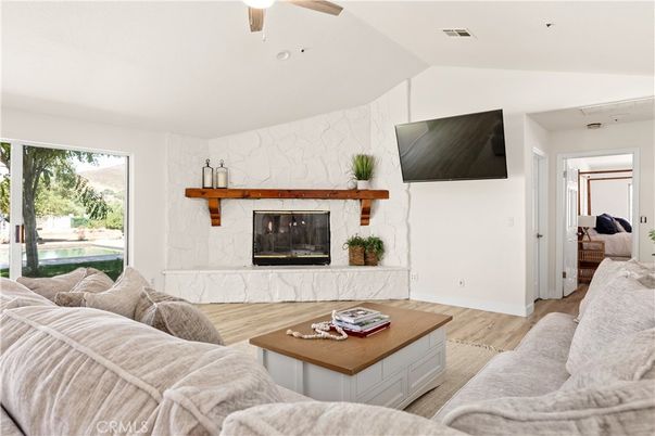 Fireplace, Interior, Living room, Marble Walls, Recessed Lighting, Wood Texture Flooring