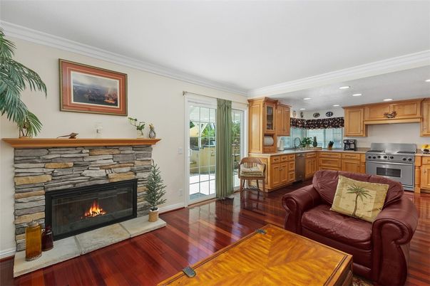 Fireplace, Interior, Kitchen, Living room, Recessed Lighting, Stainless Steel Appliances, Wood Texture Flooring