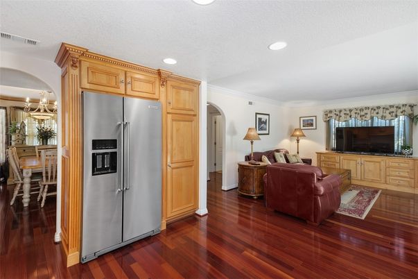 Chandelier, Dining room, Interior, Kitchen, Living room, Recessed Lighting, Stainless Steel Appliances, Wood Texture Flooring