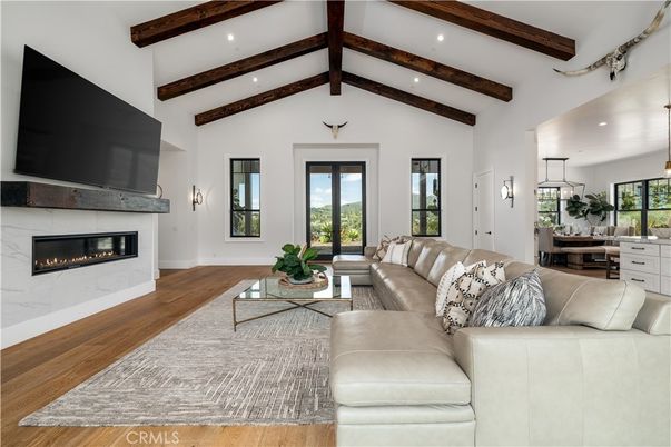 Dining room, Fireplace, Interior, Living room, Pendant Lights, Recessed Lighting, Wooden Beams, Wood Texture Flooring