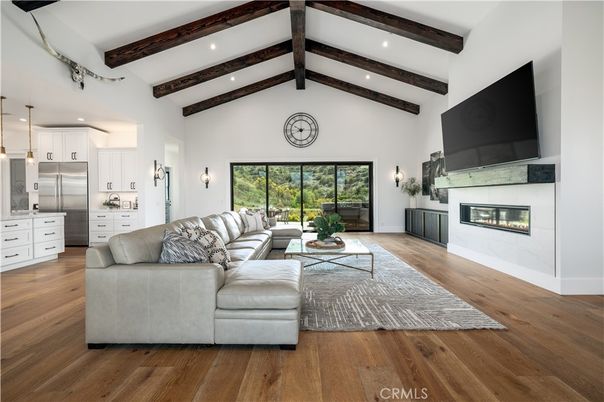 Fireplace, Interior, Kitchen, Living room, Pendant Lights, Recessed Lighting, Stainless Steel Appliances, Wooden Beams, Wood Texture Flooring