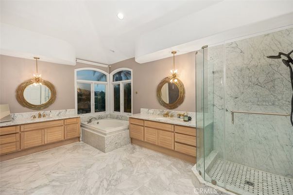 Bathroom, Dual Sink Vanities, Glass Shower, Interior, Marble, Marble Walls, Recessed Lighting