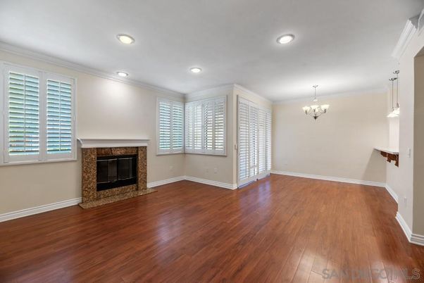 Chandelier, Empty room, Fireplace, Interior, Recessed Lighting, Wood Texture Flooring