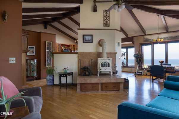 Dining room, Fireplace, Interior, Living room, Pendant Lights, Water, Wooden Beams, Wood Texture Flooring