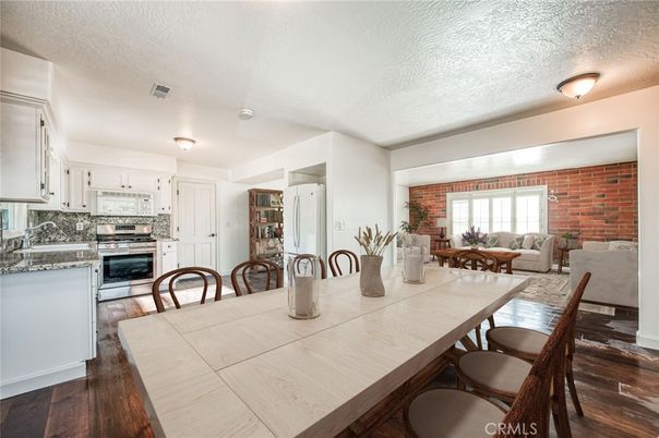 Dining room, Interior, Kitchen, Living room, Stainless Steel Appliances, Stone Walls, Wood Texture Flooring