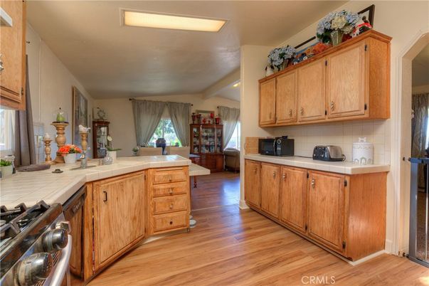 Interior, Kitchen, Recessed Lighting, Tile Countertops, Wood Texture Flooring