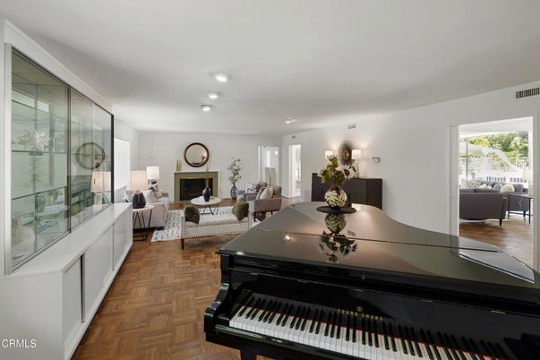 Fireplace, Interior, Living room, Piano, Recessed Lighting, Wood Texture Flooring