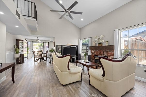 Dining room, Fireplace, Interior, Living room, Recessed Lighting, Wood Texture Flooring