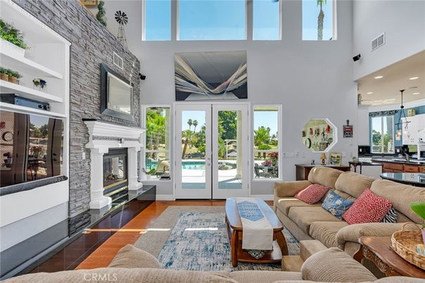 Fireplace, Interior, Living room, Pendant Lights, Recessed Lighting, Stone Walls, Wood Texture Flooring