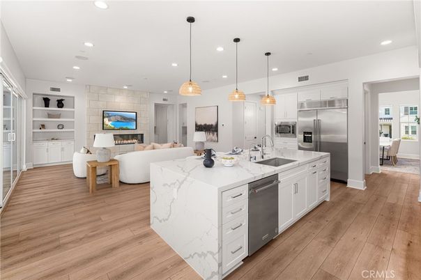 Fireplace, Interior, Kitchen, Living room, Pendant Lights, Recessed Lighting, Stainless Steel Appliances, Wood Texture Flooring