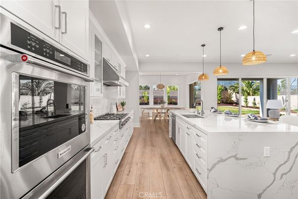 Dining room, Interior, Kitchen, Pendant Lights, Recessed Lighting, Stainless Steel Appliances, Wood Texture Flooring