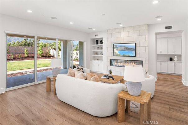 Fireplace, Interior, Living room, Recessed Lighting, Stone Walls, Wood Texture Flooring