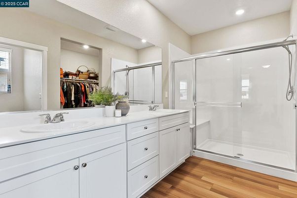Bathroom, Dual Sink Vanities, Glass Shower, Interior, Recessed Lighting, Walk-in Closets, Wood Texture Flooring