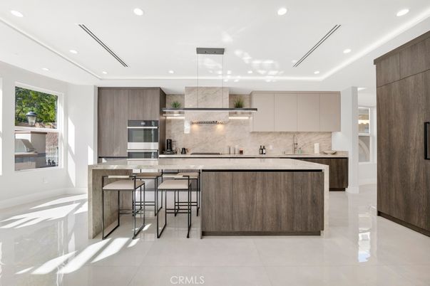 Interior, Kitchen, Marble Walls, Pendant Lights, Recessed Lighting, Stainless Steel Appliances
