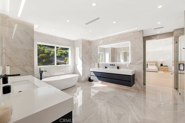 Bathroom, Dual Sink Vanities, Free Standing Baths, Glass Shower, Interior, Marble, Marble Walls, Recessed Lighting