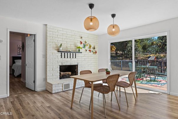 Dining room, Fireplace, Interior, Pendant Lights, Stone Walls, Wood Texture Flooring