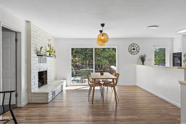Dining room, Fireplace, Interior, Pendant Lights, Stone Walls, Wood Texture Flooring