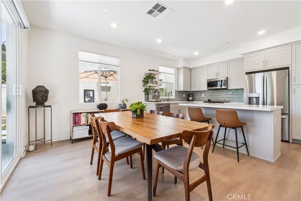 Dining room, Interior, Kitchen, Recessed Lighting, Stainless Steel Appliances, Wood Texture Flooring