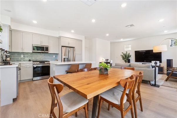 Dining room, Interior, Kitchen, Living room, Recessed Lighting, Stainless Steel Appliances, Wood Texture Flooring