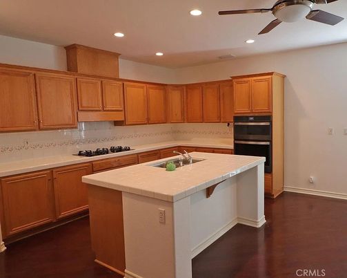 Interior, Kitchen, Recessed Lighting, Tile Countertops, Wood Texture Flooring