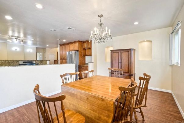 Chandelier, Dining room, Interior, Kitchen, Recessed Lighting, Stainless Steel Appliances, Wood Texture Flooring
