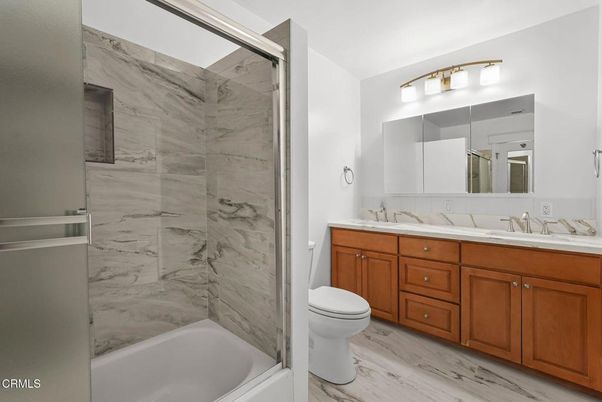 Bathroom, Dual Sink Vanities, Interior, Marble Walls, Wood Texture Flooring