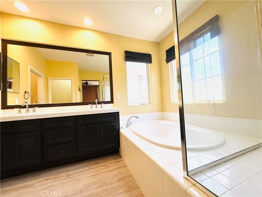 Bathroom, Dual Sink Vanities, Interior, Recessed Lighting, Tile Countertops, Wood Texture Flooring
