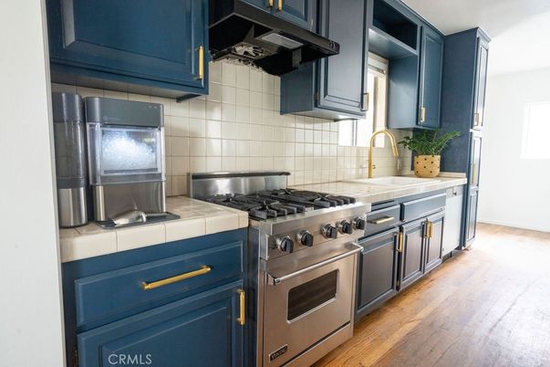 Interior, Kitchen, Stainless Steel Appliances, Tile Countertops, Wood Texture Flooring