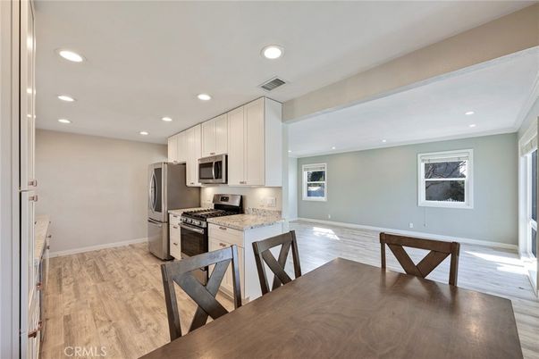 Dining room, Interior, Kitchen, Recessed Lighting, Stainless Steel Appliances, Wood Texture Flooring